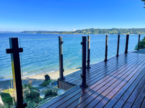 Glass railing system on a deck overlooking Puget Sound in Washington.