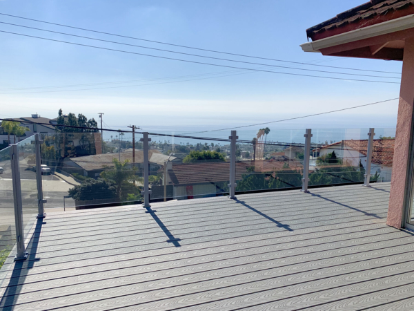 Glass railing keeps this view of the city and water below nice and open