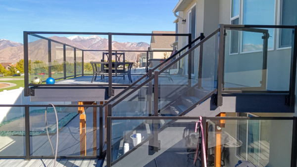 Glass railing allows these decks to feel open and spacious, even when they are stacked on top of each other.
