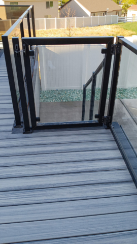 Glass railing gate on a deck and staircase in Tooele, UT.
